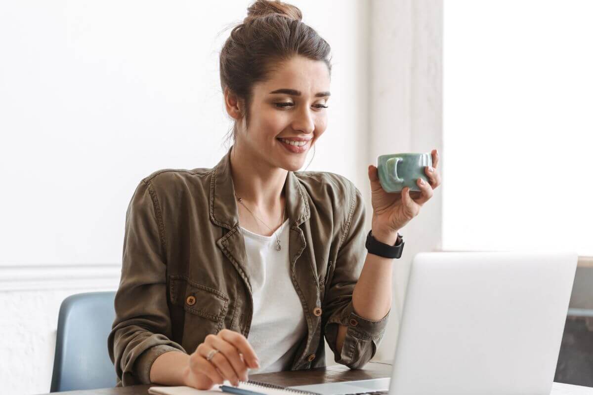 A picture shows a woman using a laptop.