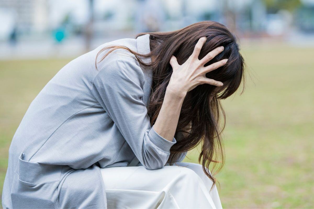 An image of a stressed woman.