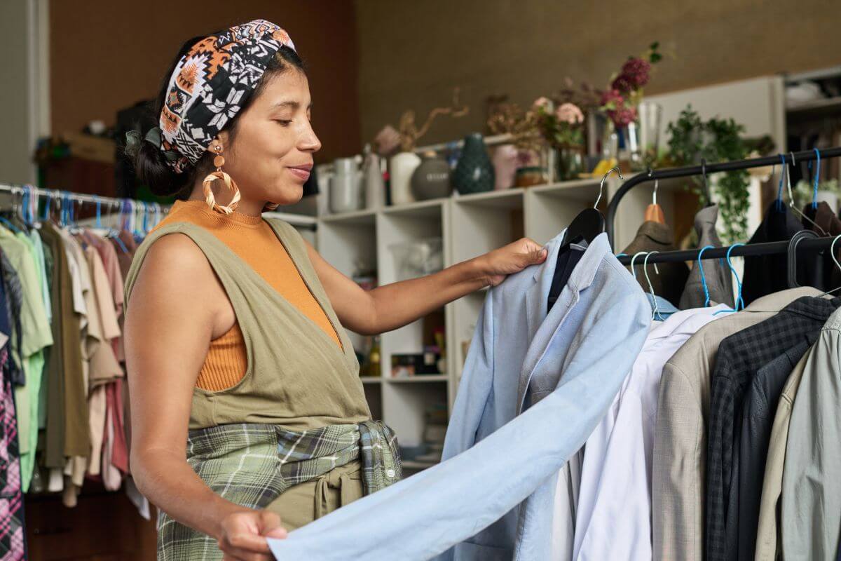 A picture of a woman thrift shopping.