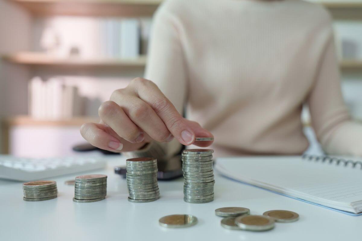 A picture of someone arranging coins.