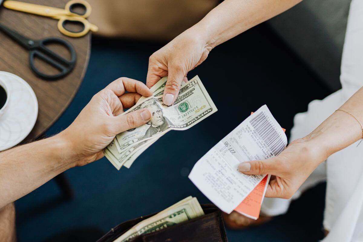 A picture of someone paying their debt.