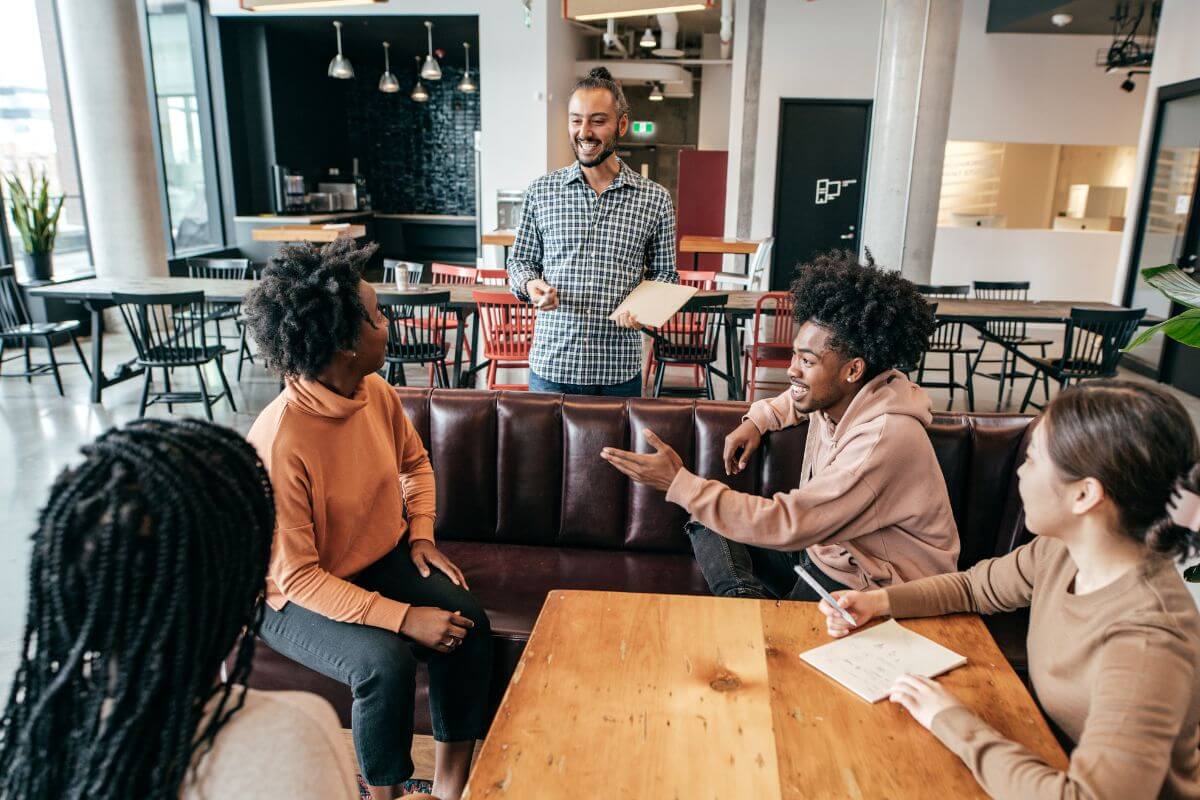 A picture of people learning from each other.