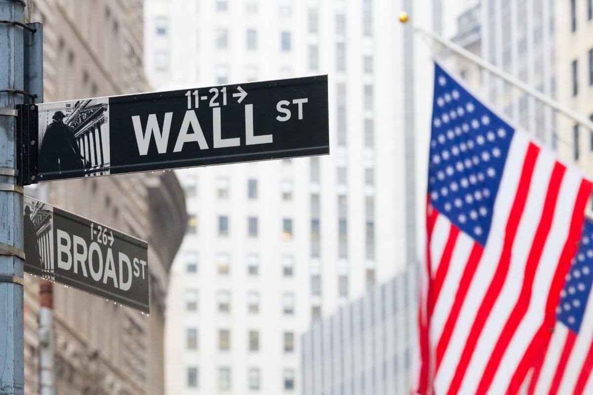 A picture of a street sign to Wall Street.