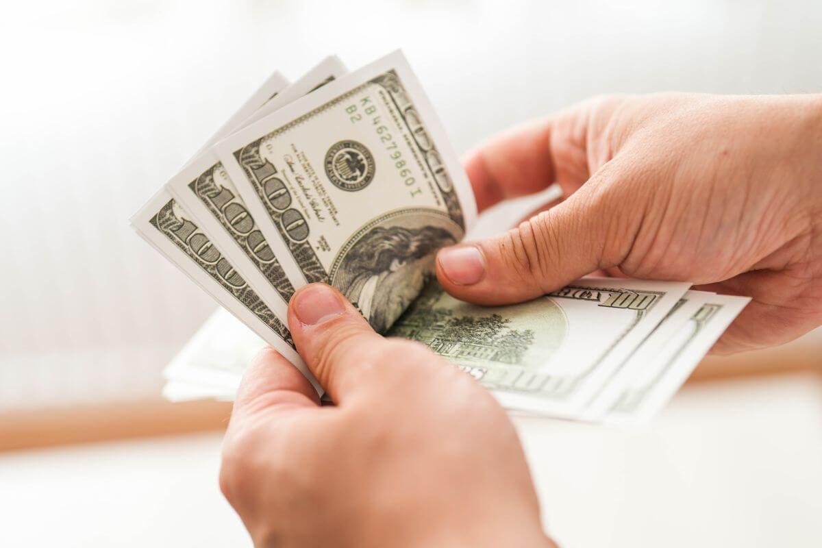 A picture of someone counting money.