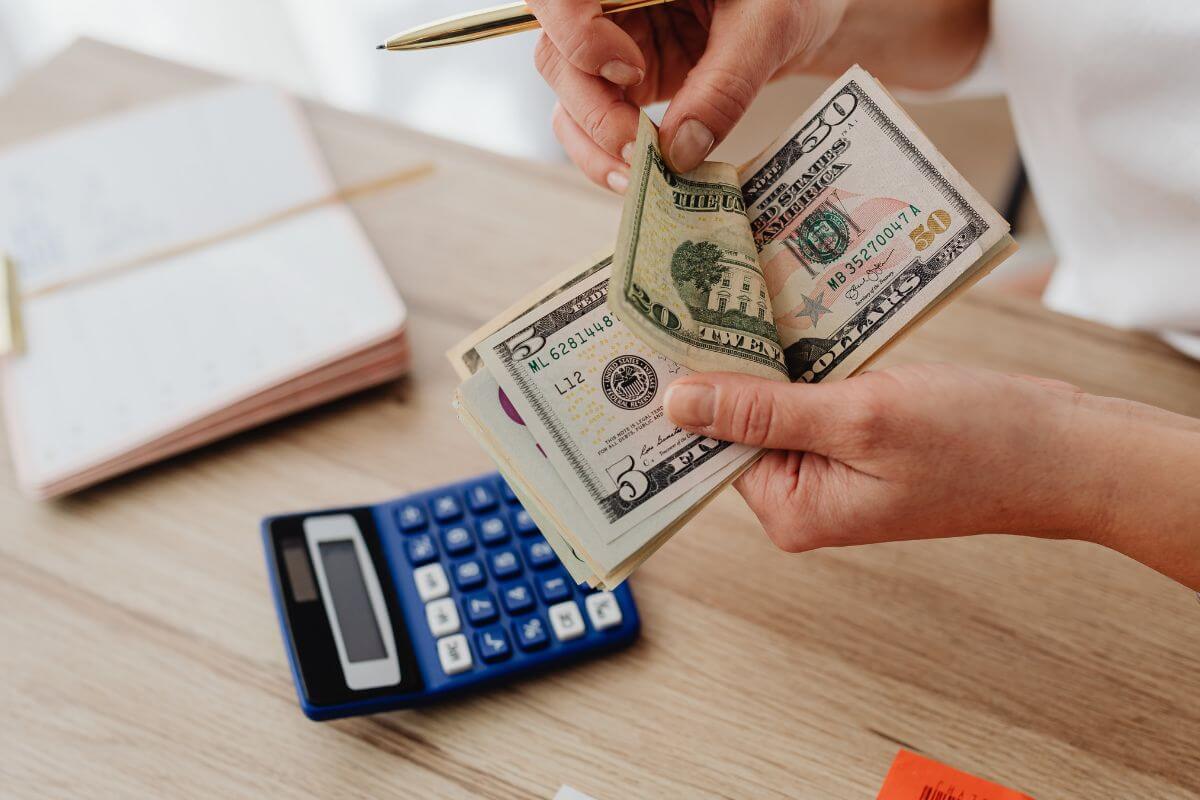 A picture of someone counting money.