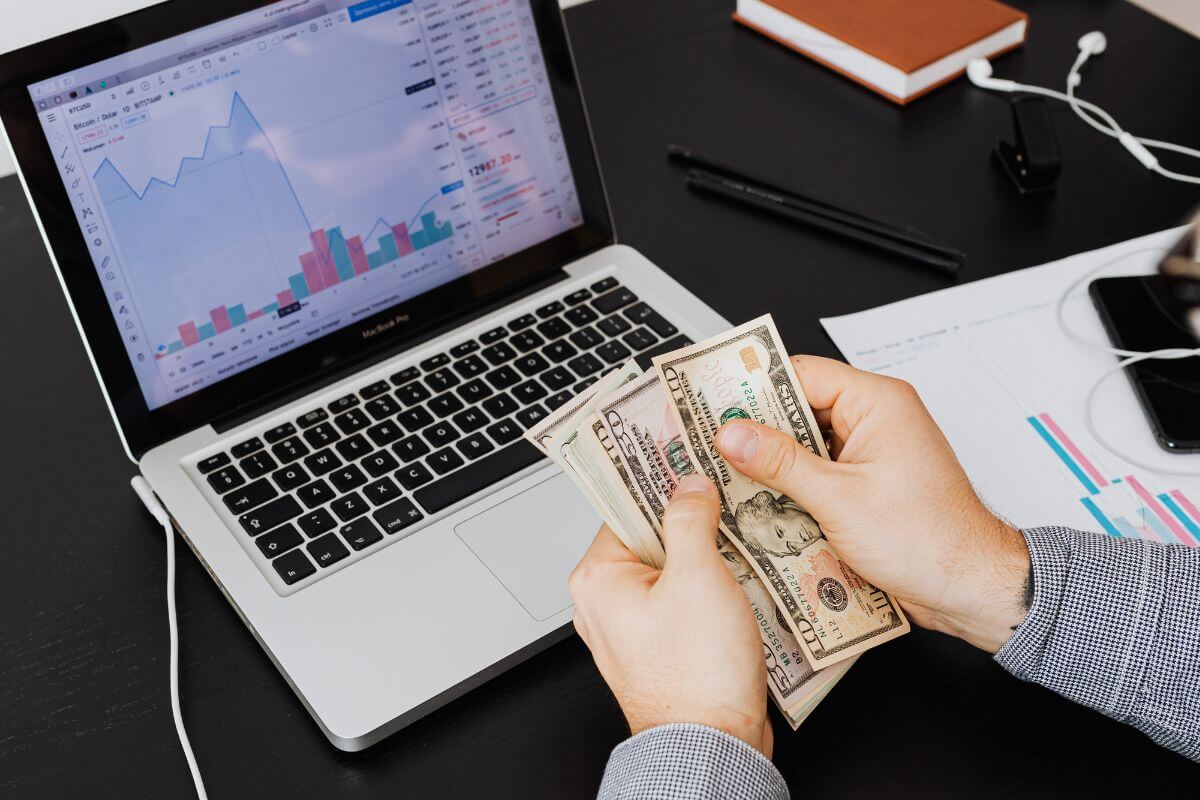 A picture of someone counting bank notes.