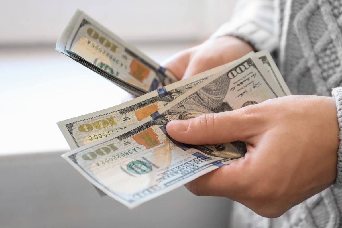 A picture of someone counting money.