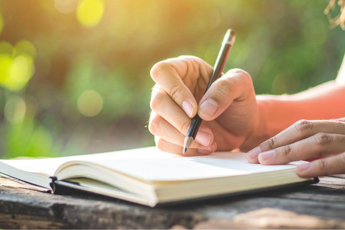 A picture of someone writing.