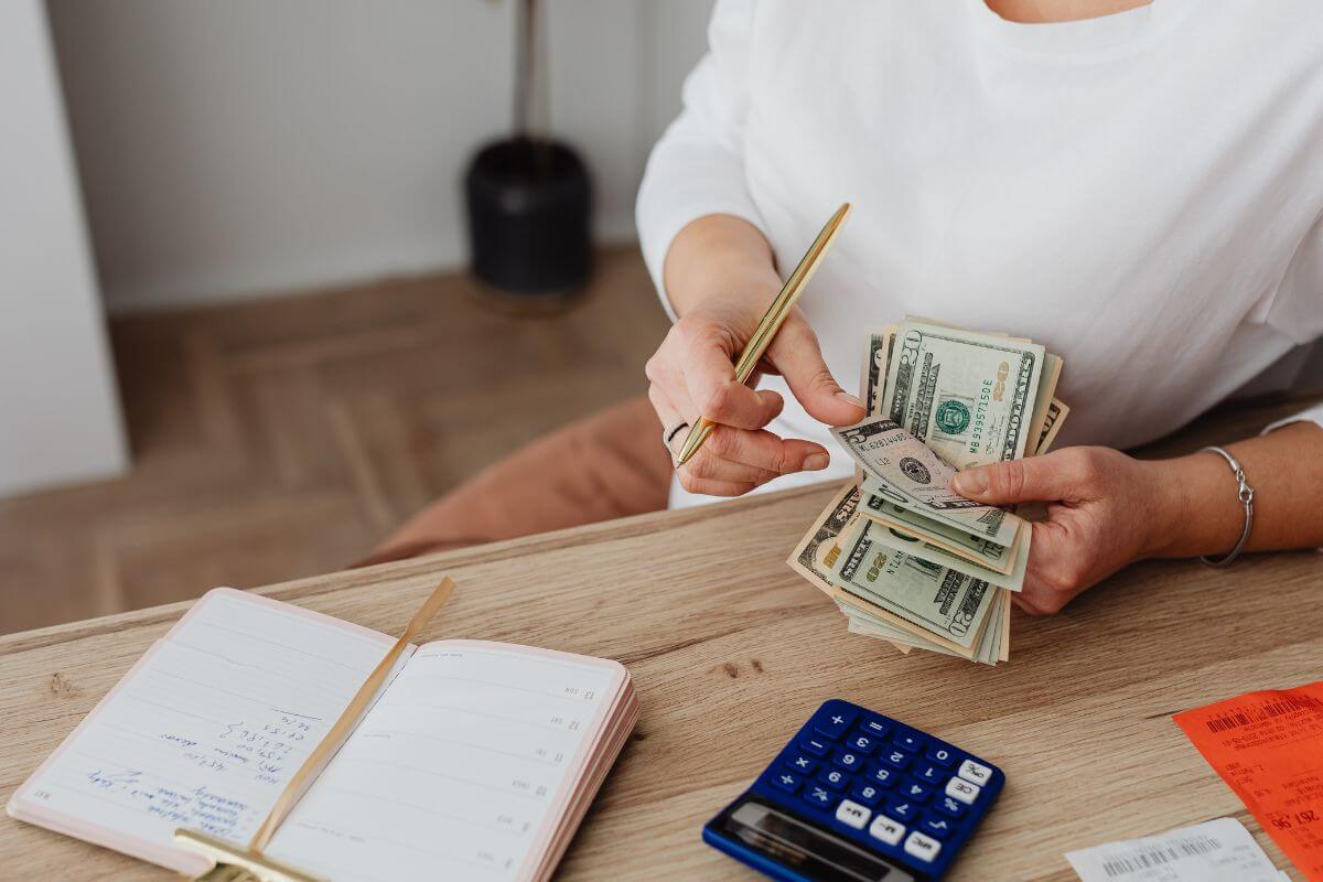 A picture of someone counting money.