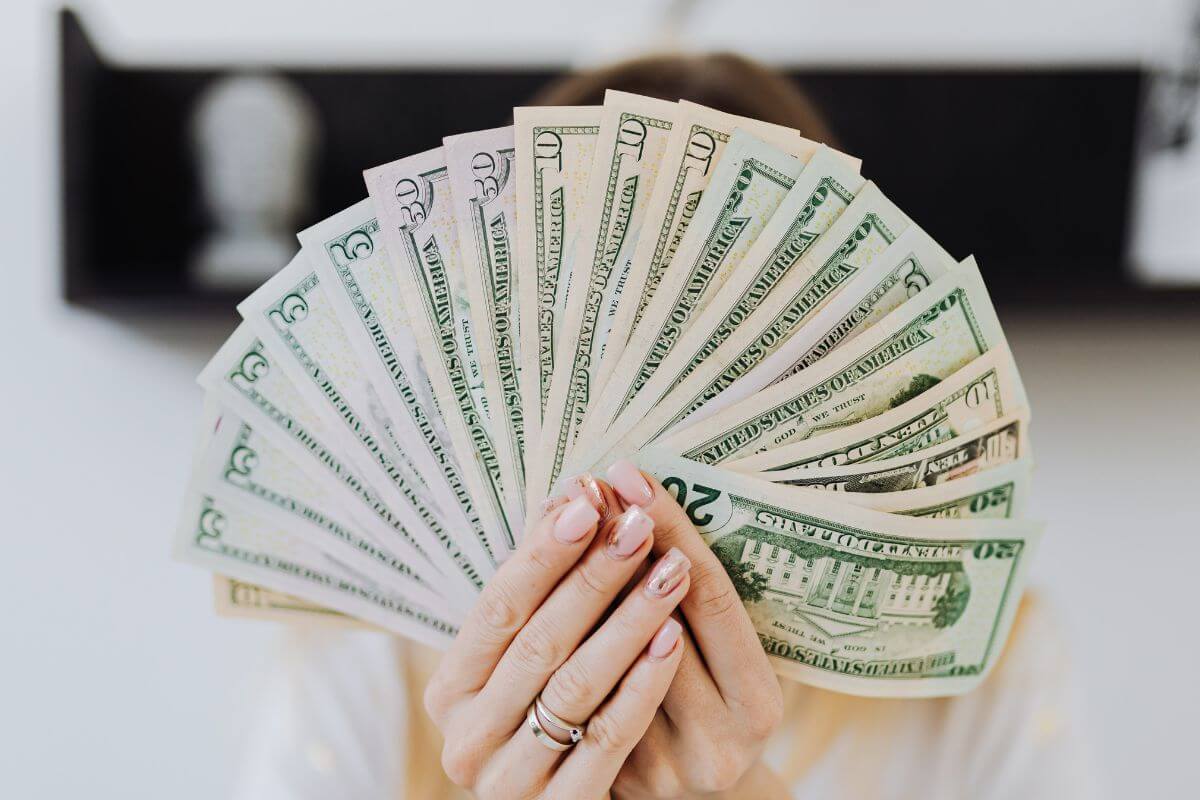 A picture of someone with money.