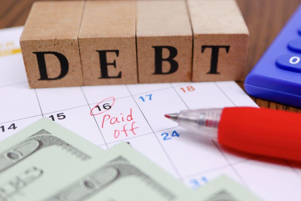 A picture of someone paying debt.