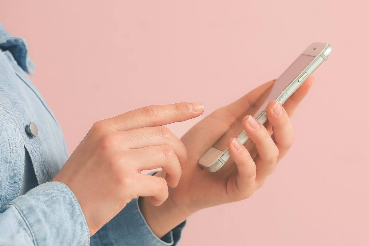 A picture of someone using their phone.