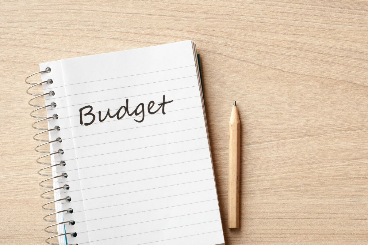 A picture of a notebook with budget wording.
