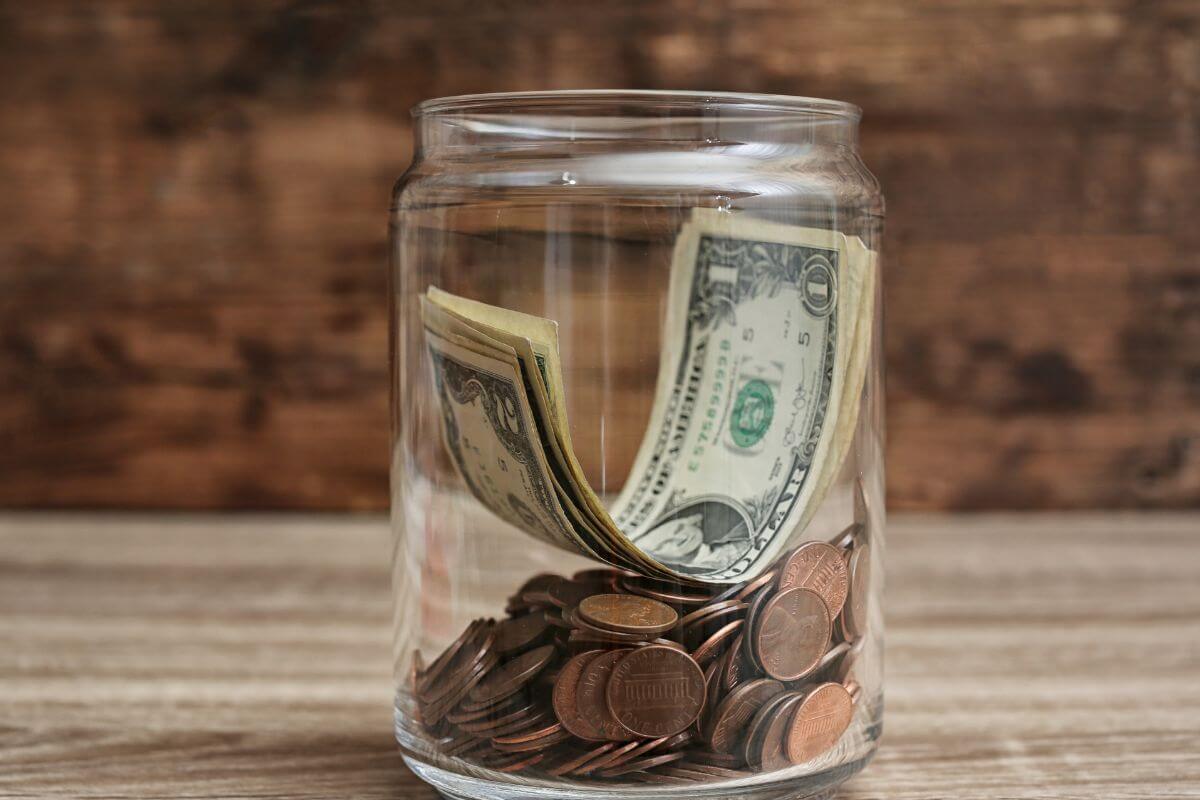 A picture shows a jar with money.