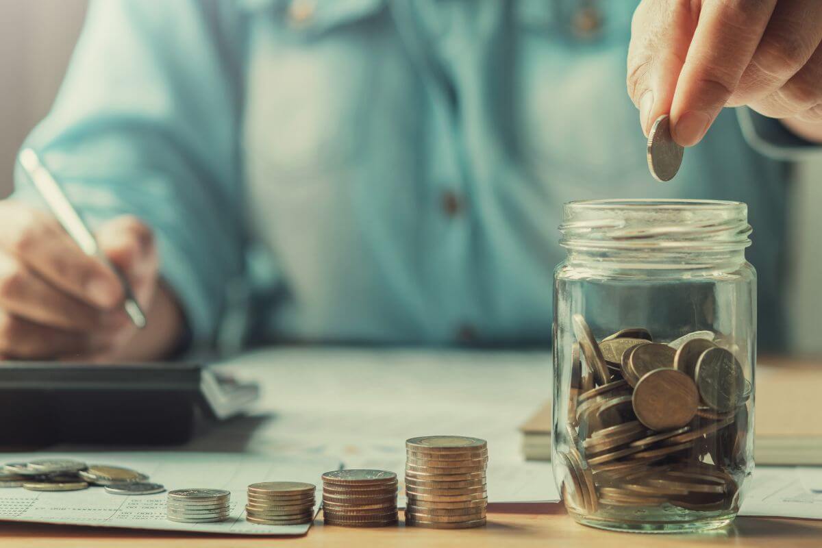 An image shows a woman saving money.