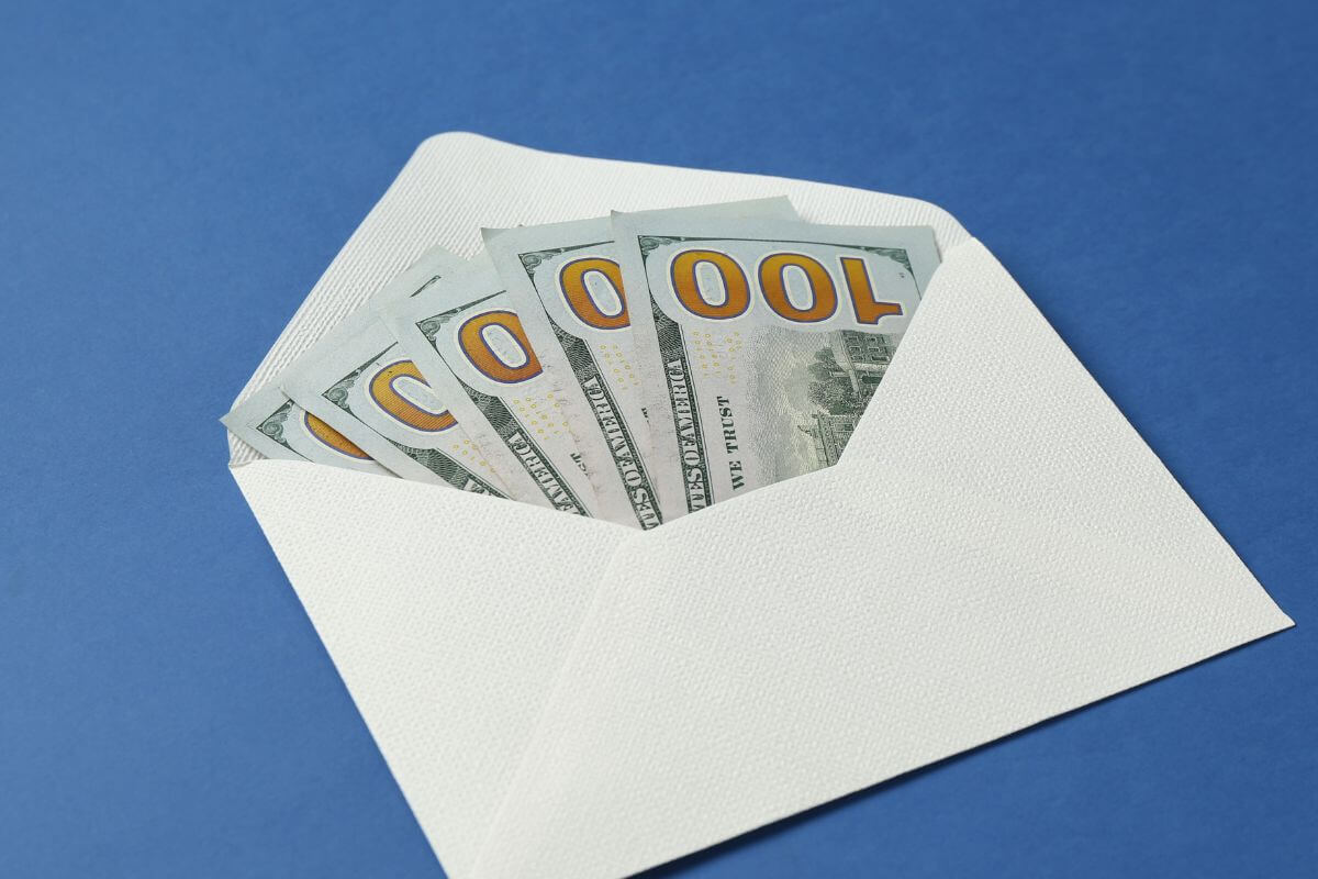 A picture of an envelope with money inside.