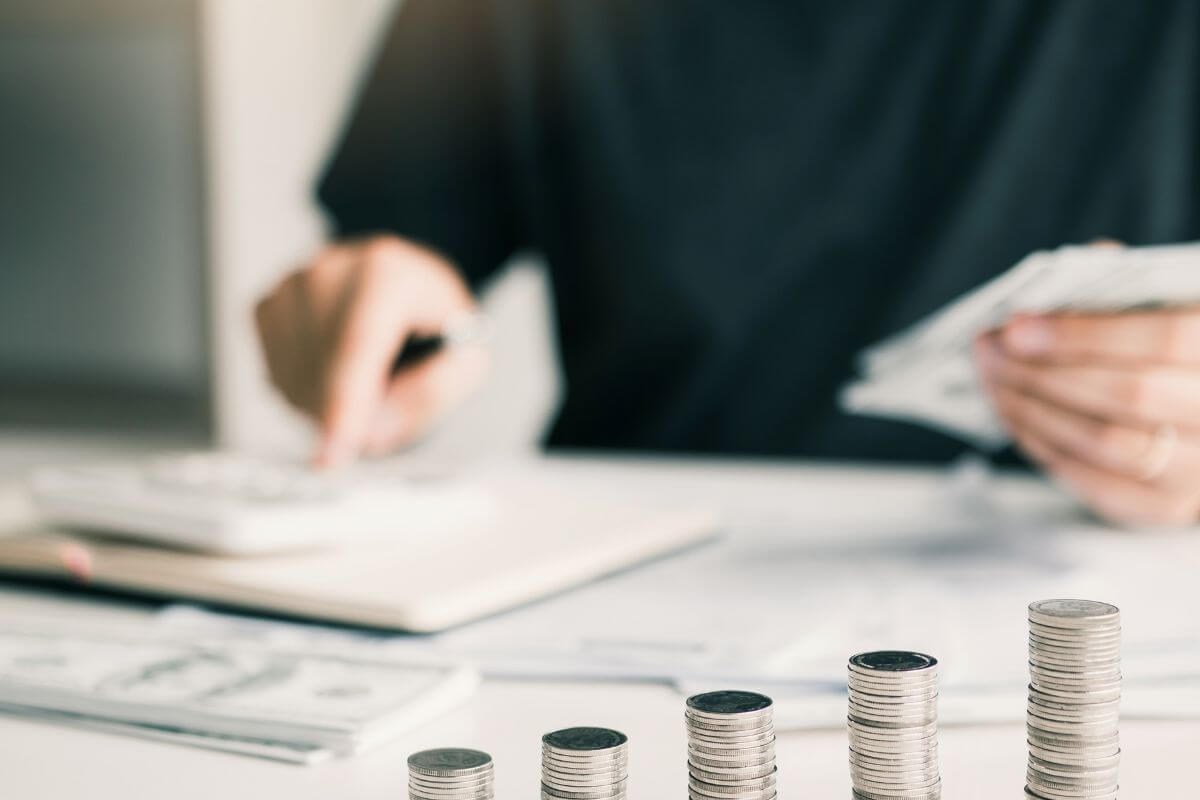 A picture of a woman calculating money.