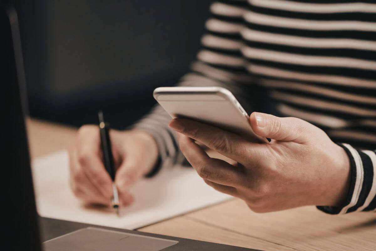 A picture shows a woman researching something online.