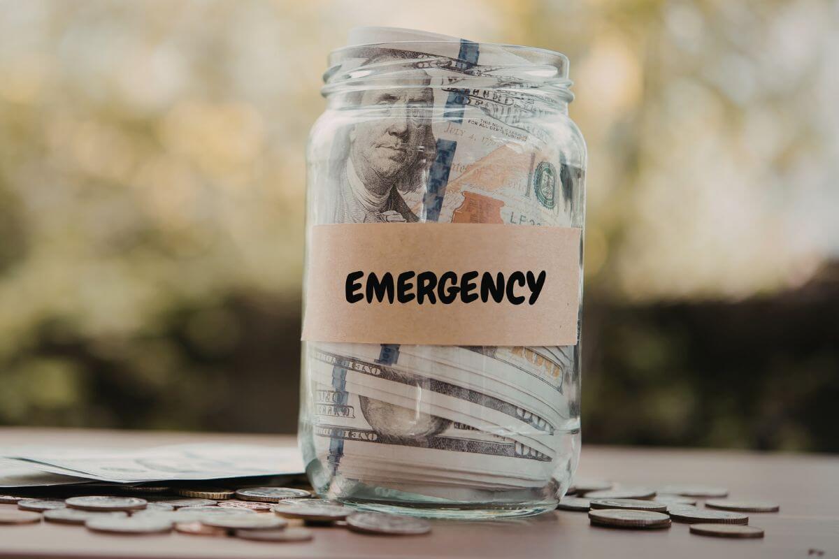 A picture shows a jar with an emergency fund.