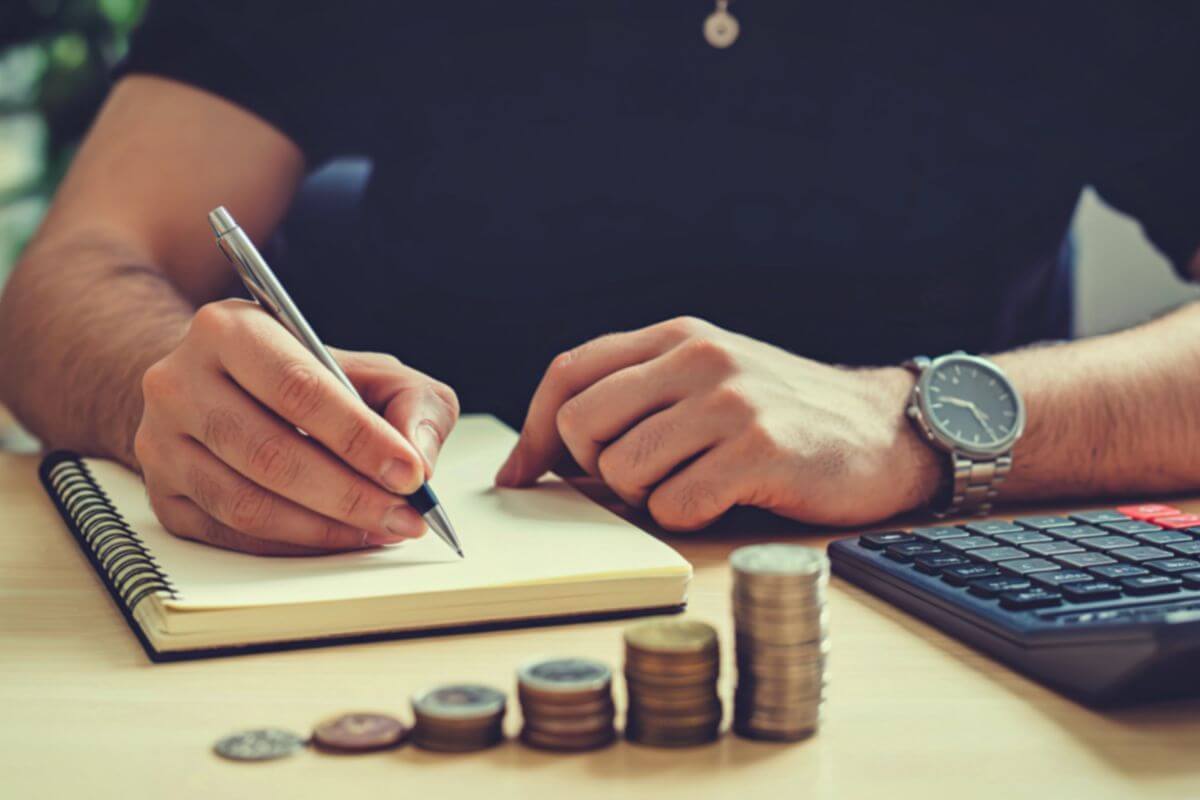A picture of a man making a budget.
