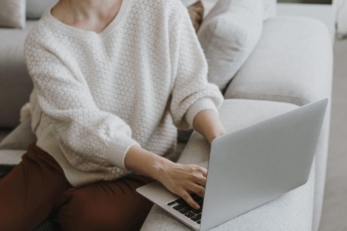 A picture shows a woman using a laptop.