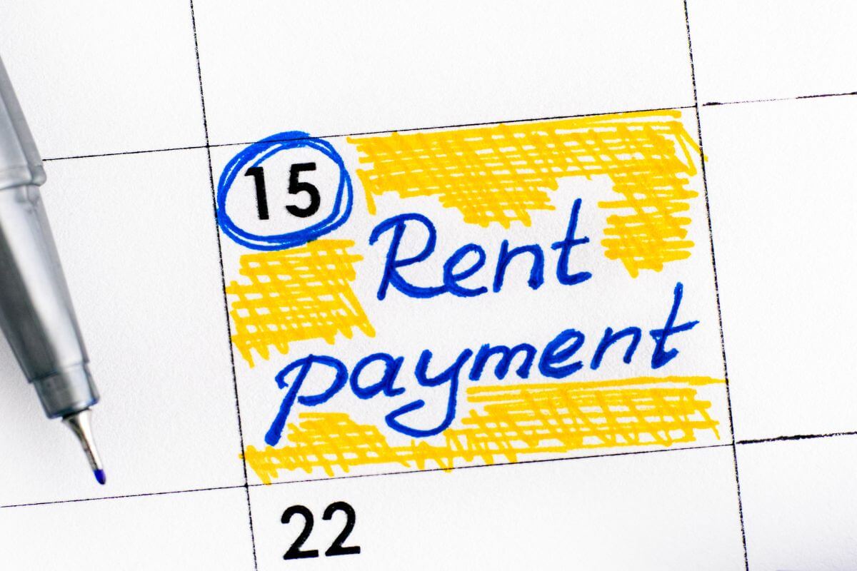 An image of a paper with a rent payment note.
