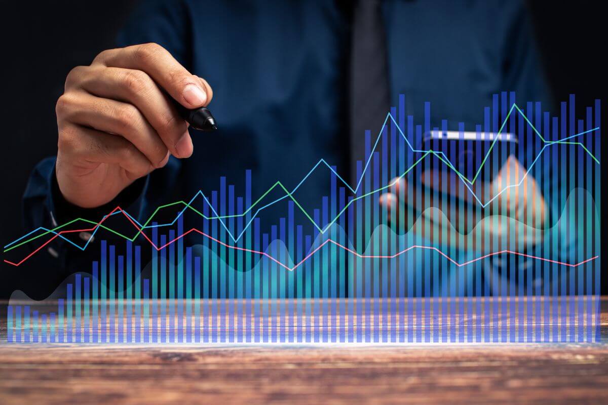 A photo of a man monitoring stock trading data.