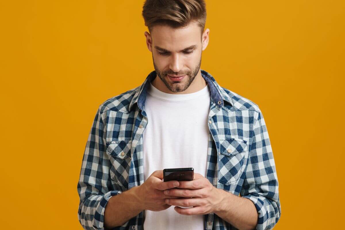 An image of a man using a phone.