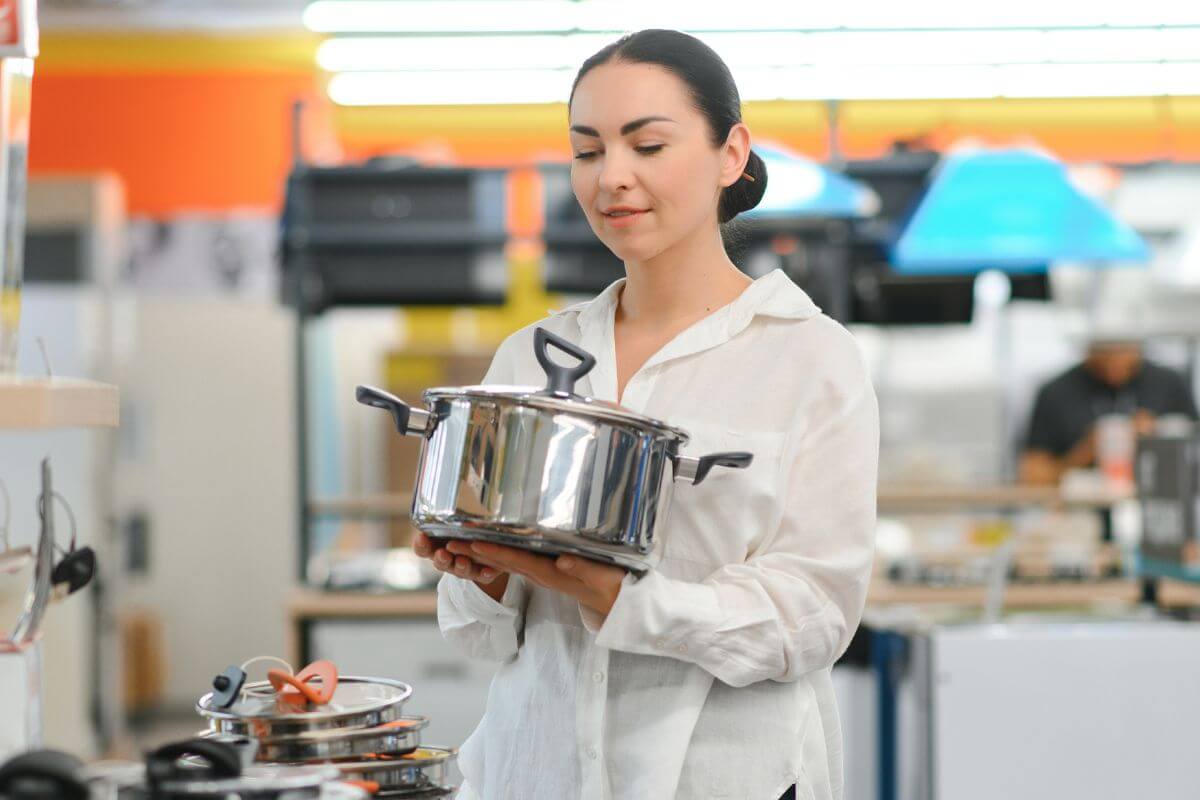 A picture shows a woman shopping for appliances.