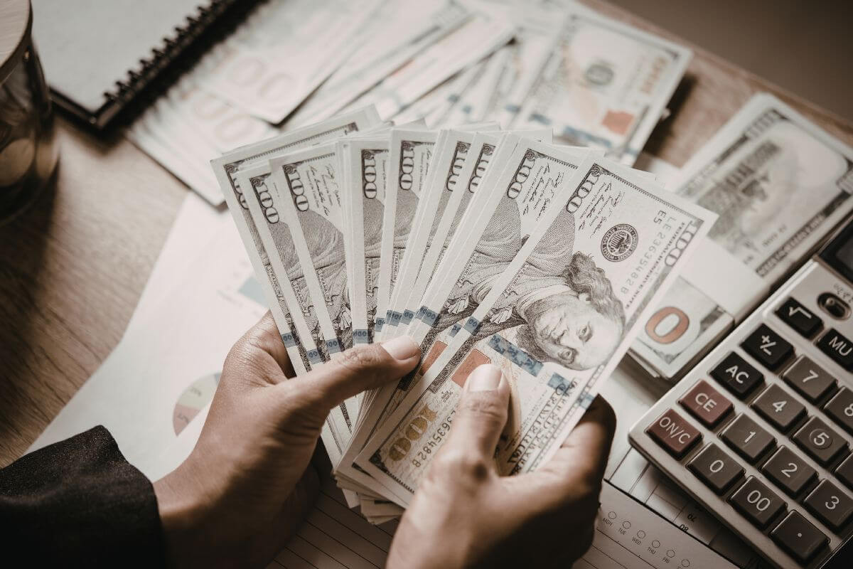 A picture of a man holding money.