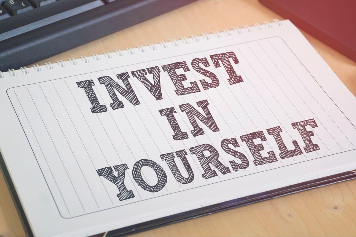 A picture of a notebook with the wording 'Invest in Yourself'.