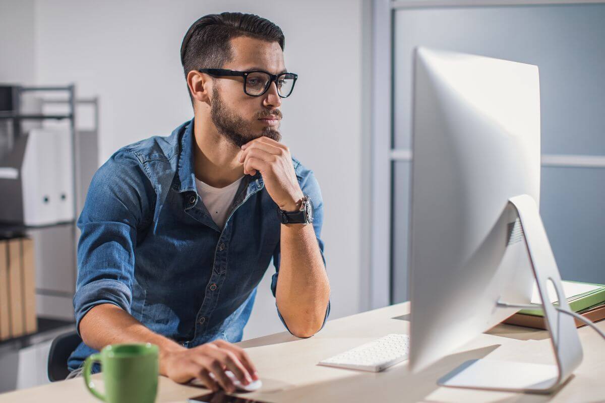 A picture shows a man working on a computer.