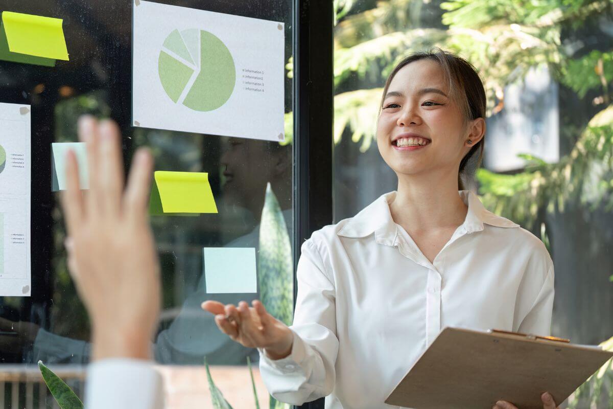 An image shows a woman reporting something.