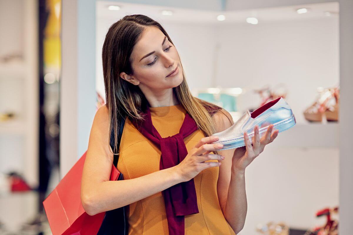 A picture shows a woman shopping for shoes.