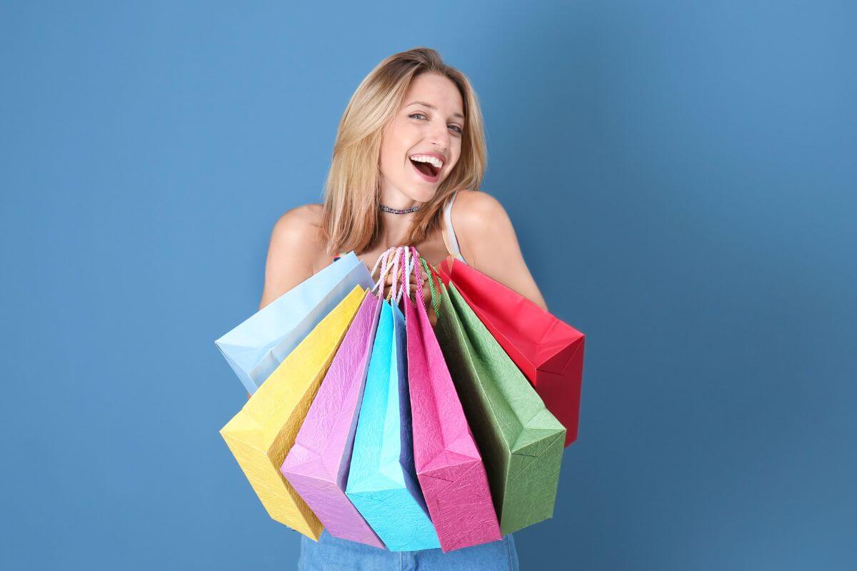 A picture shows a woman holding shopping bags.