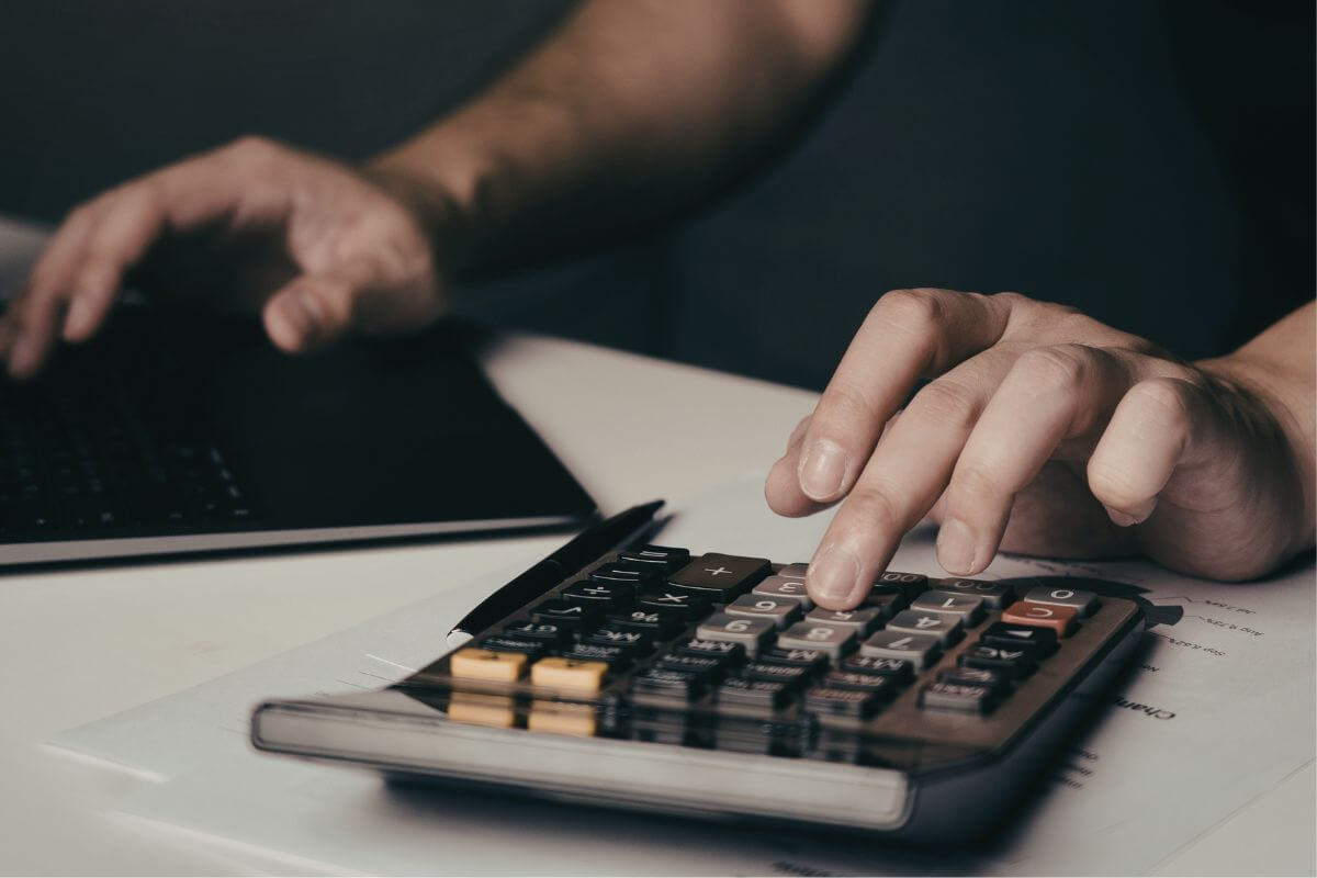 A picture shows a man calculating something.