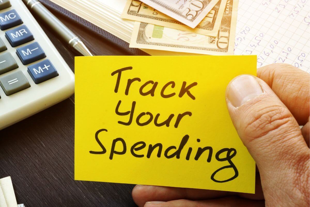 A picture of a paper with the " Track Your Spending " wording.