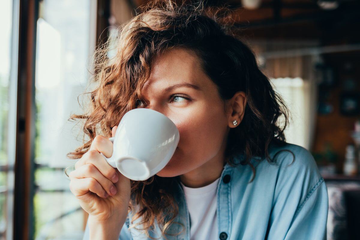 An image of a woman drinking coffee.