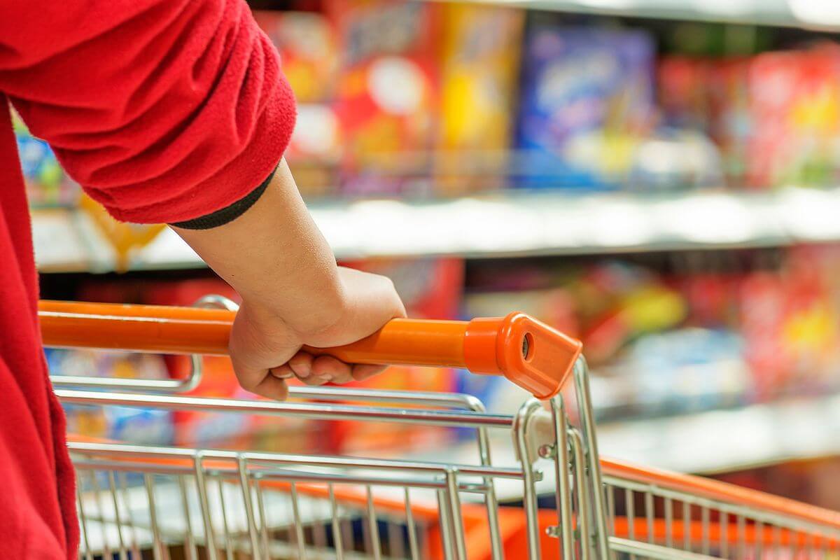 A photo shows a man holding the cart.
