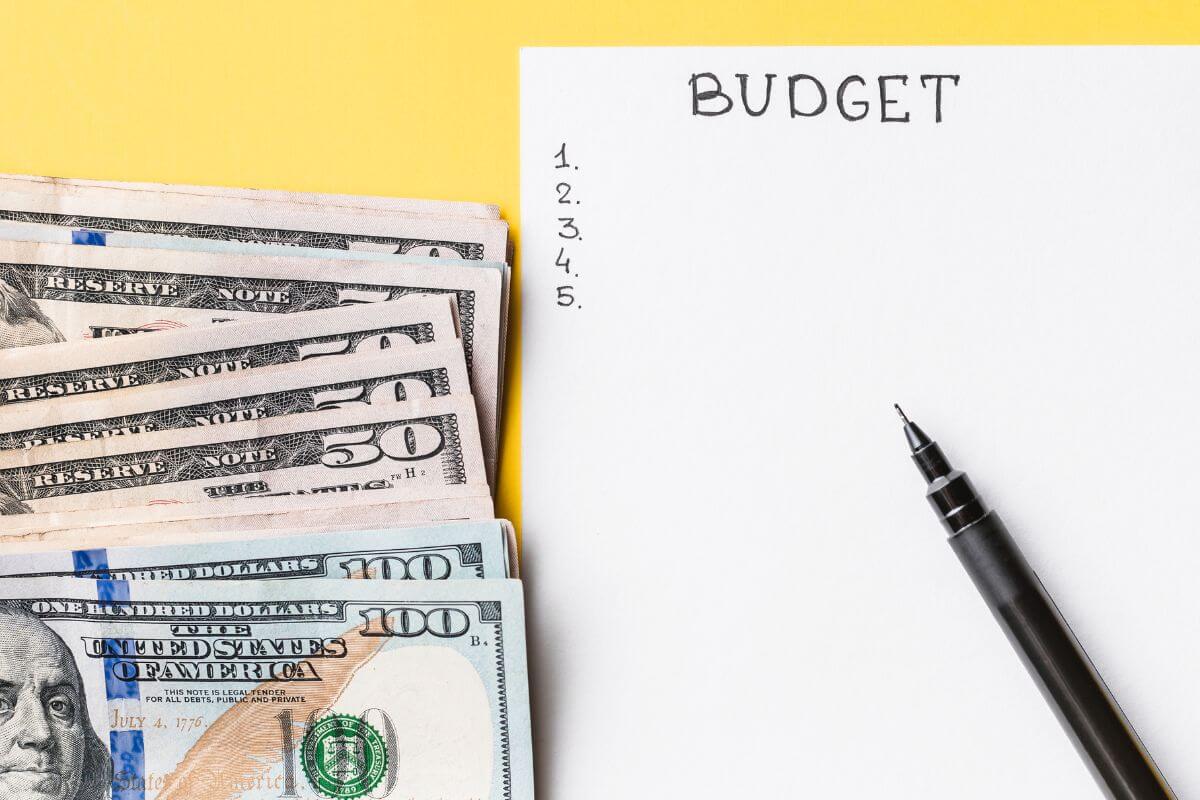 A picture tells about a paper with budget wording and money.