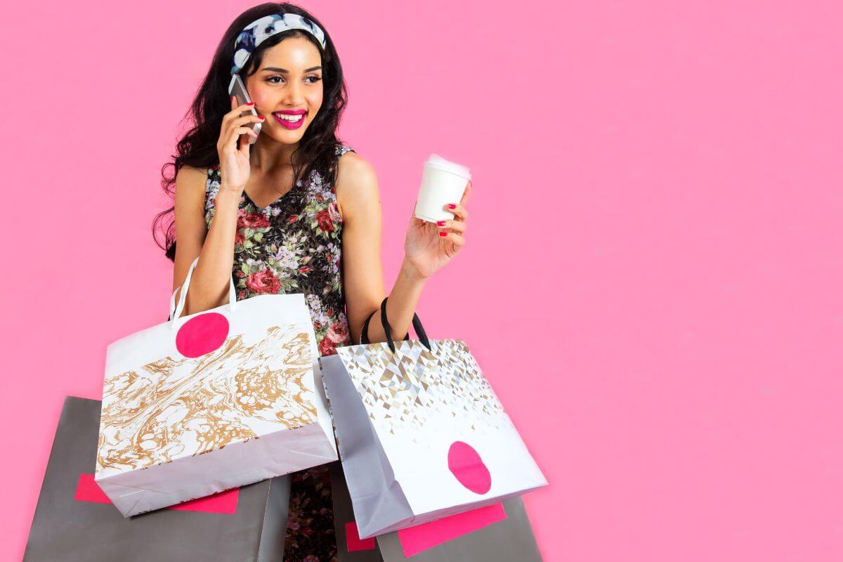 A picture of a woman carrying shopping bags.