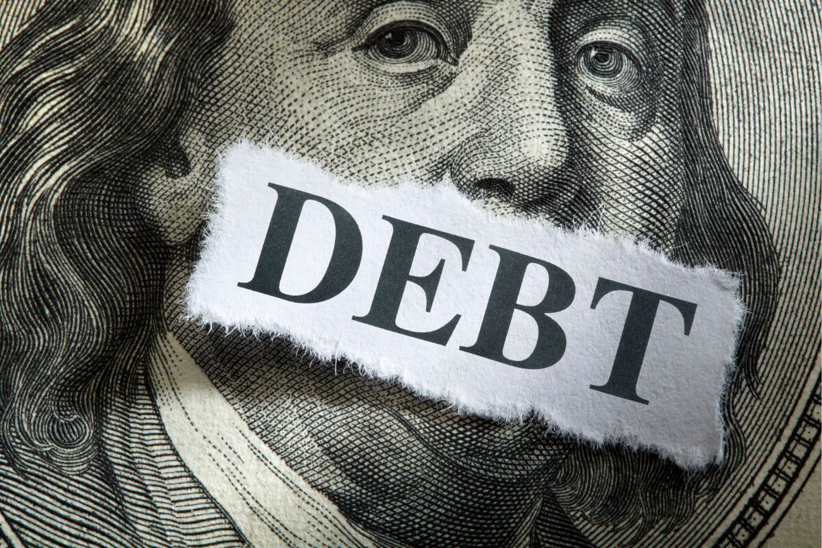 A picture of a paper with debt wording.