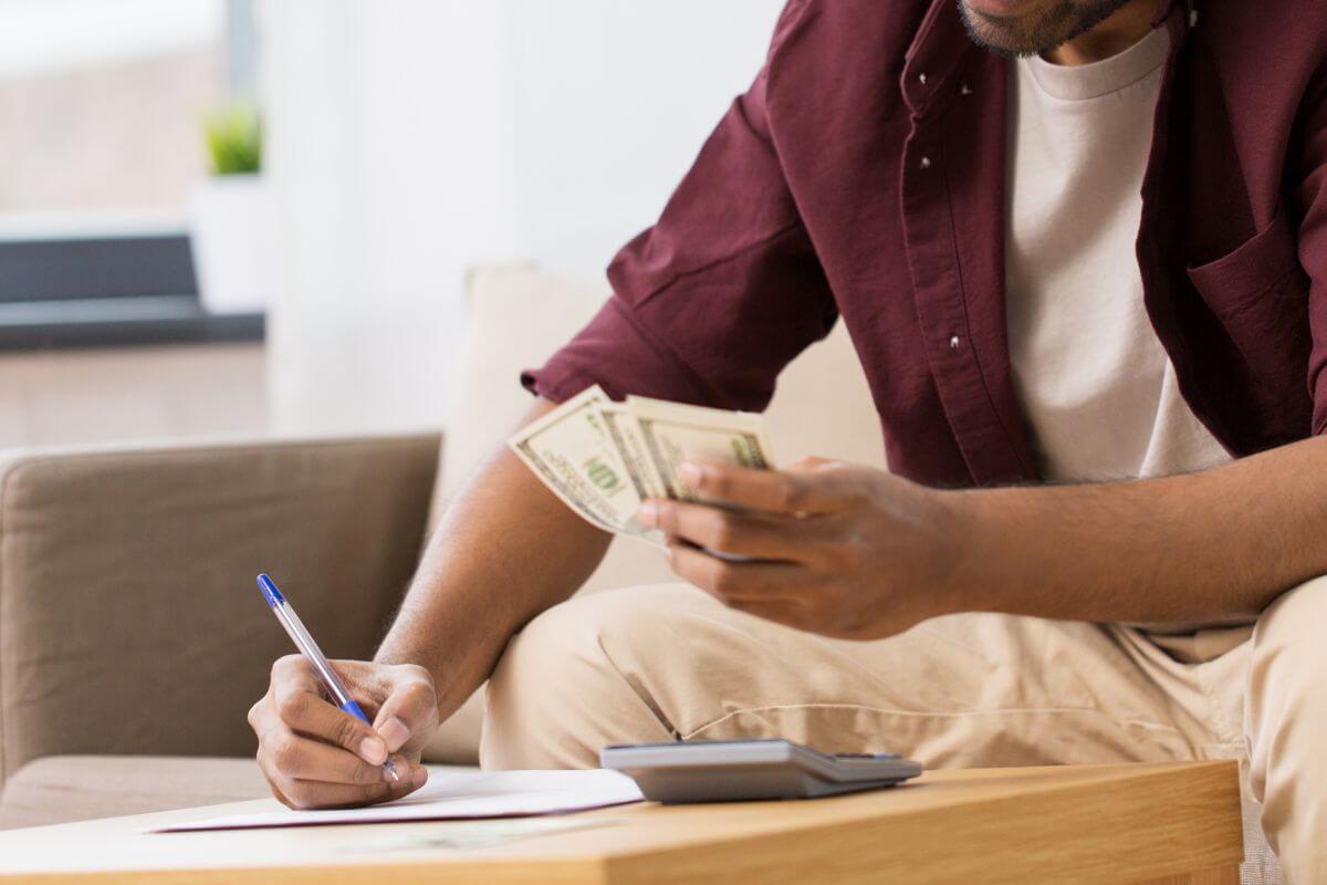 A picture shows a man tracking his money.