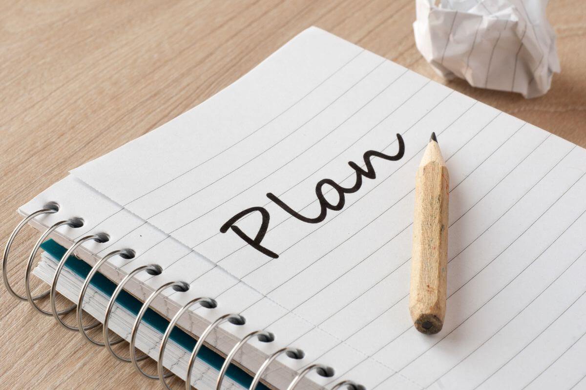 A picture of a notebook with a plan written on it.