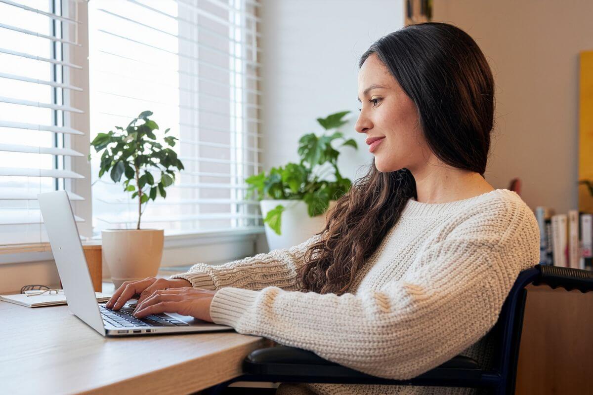 An image shows a woman using a laptop.