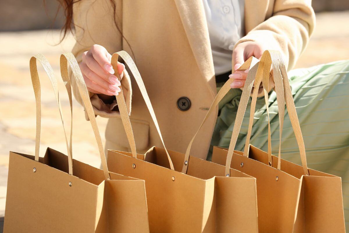 A picture of a woman with her shopping bags.