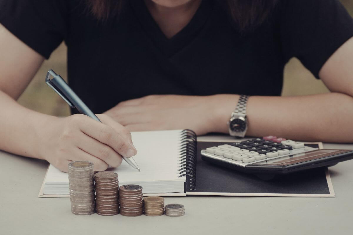 A picture shows a woman tracking her money.