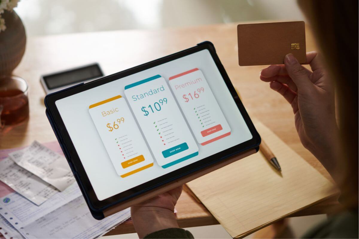 A photo of a woman paying for her subscription online.