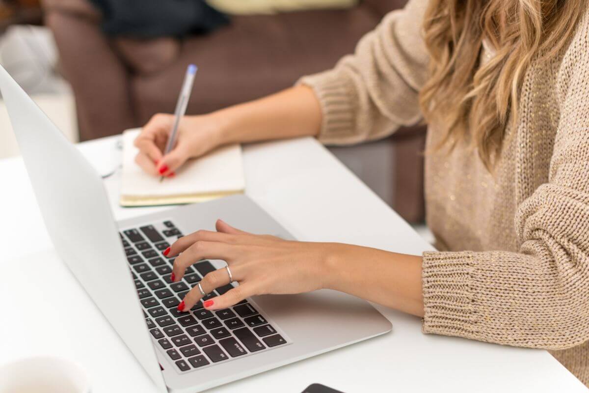 A picture of a woman using a laptop.