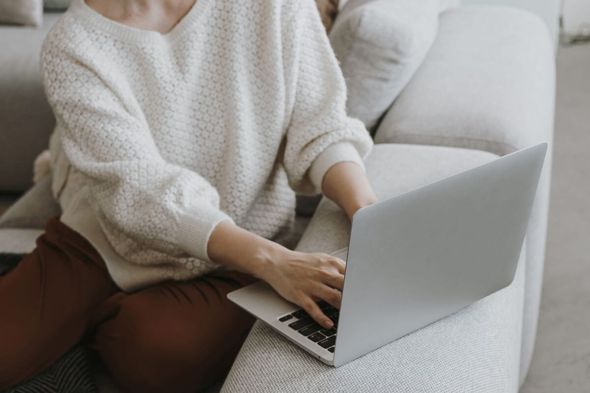 A picture of a woman using a laptop.